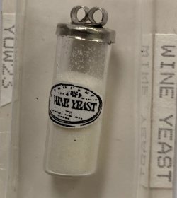 Glass canister of wine yeast